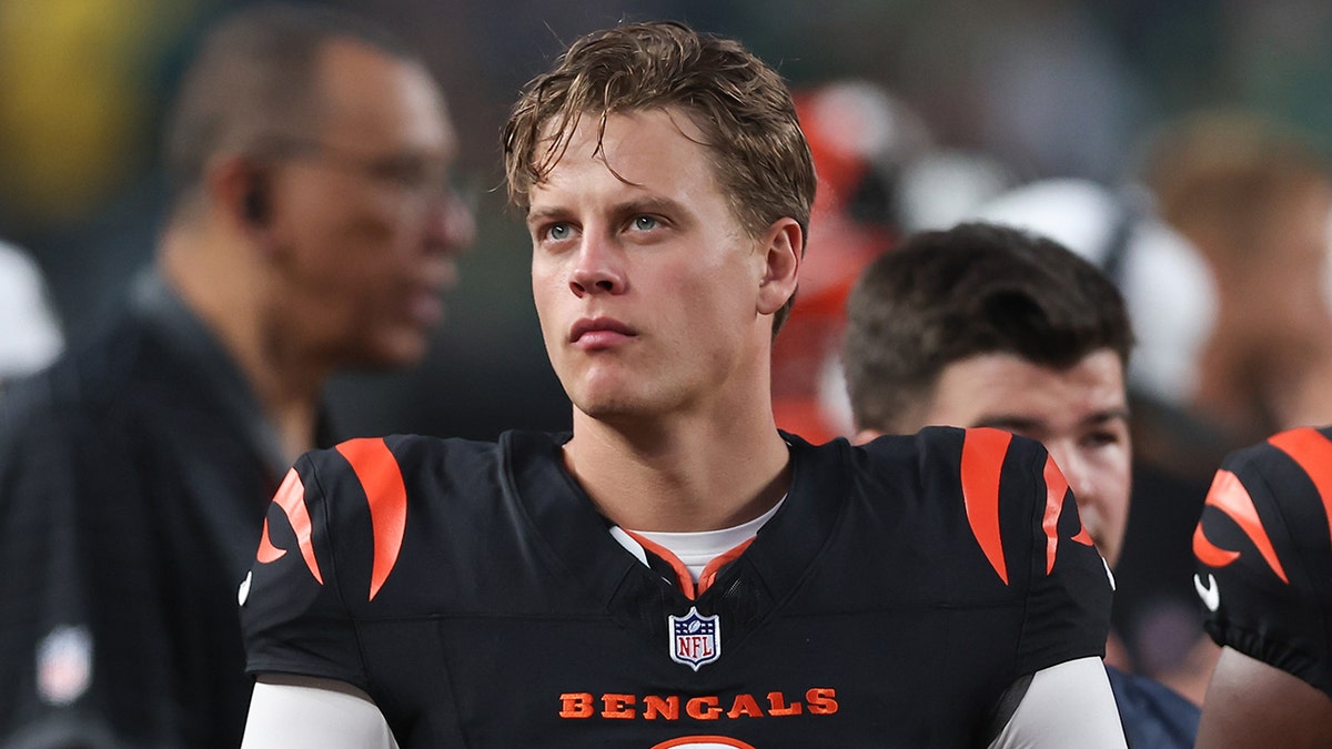 Joe Burrow looks on field