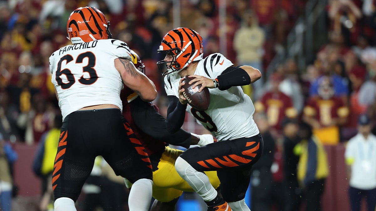Joe Burrow scrambles during play