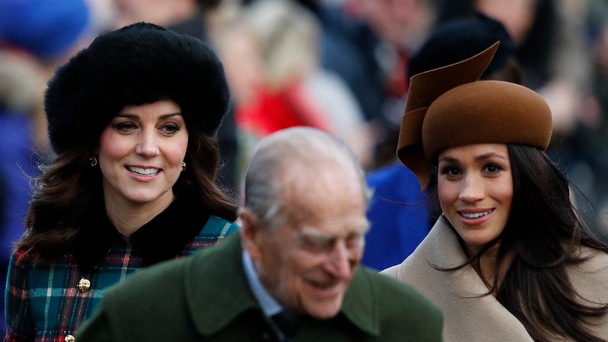 Prince Philip gave Kate Middleton golden rule for surviving the monarchy 10 Kate Middleton and Meghan Markle walking behind Prince Philip.