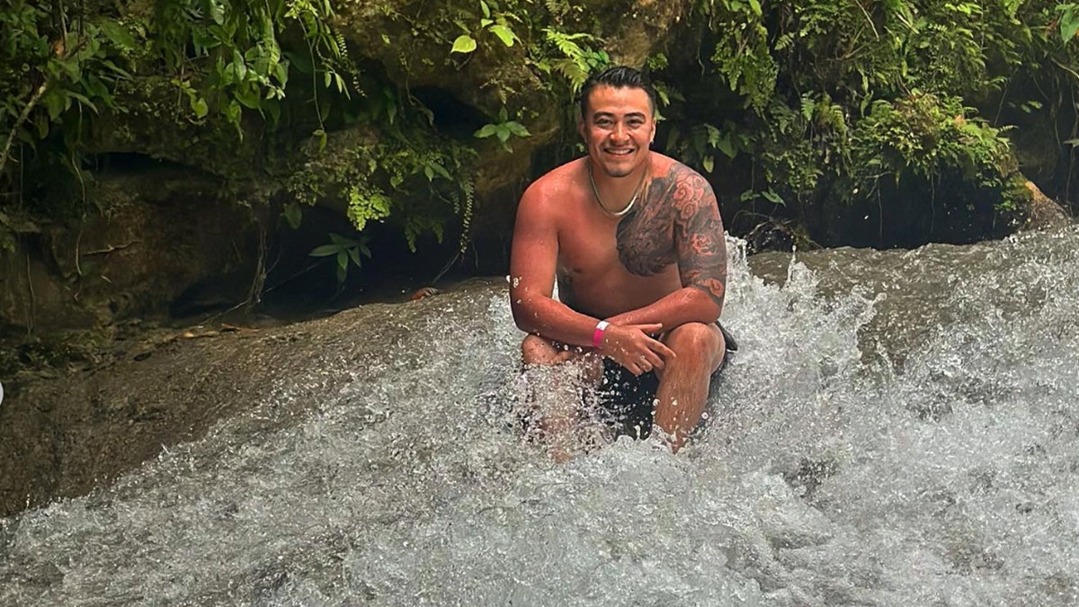Kevin Marez poses in the picture while in the water