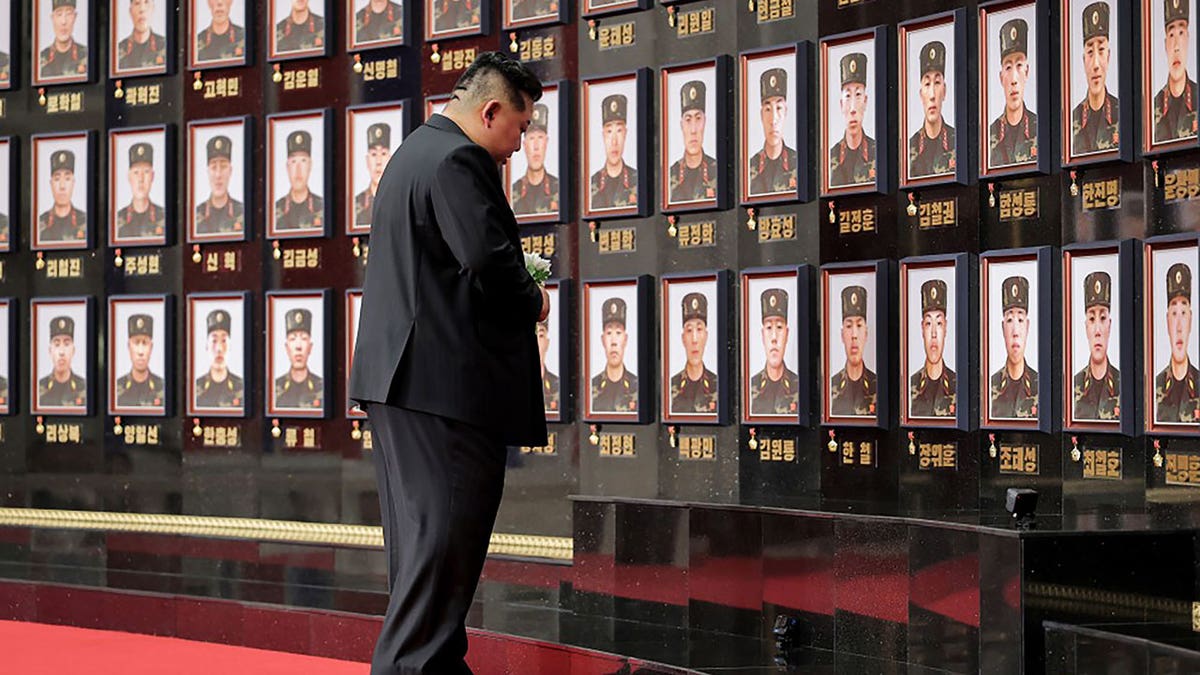 Kim Jong a kissing a soldier