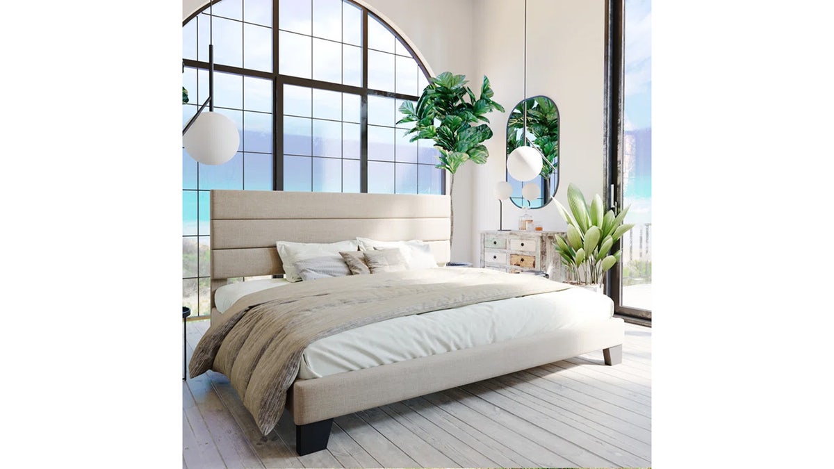 Sleep in comfort with this platform bed complete with an upholstered headboard. 