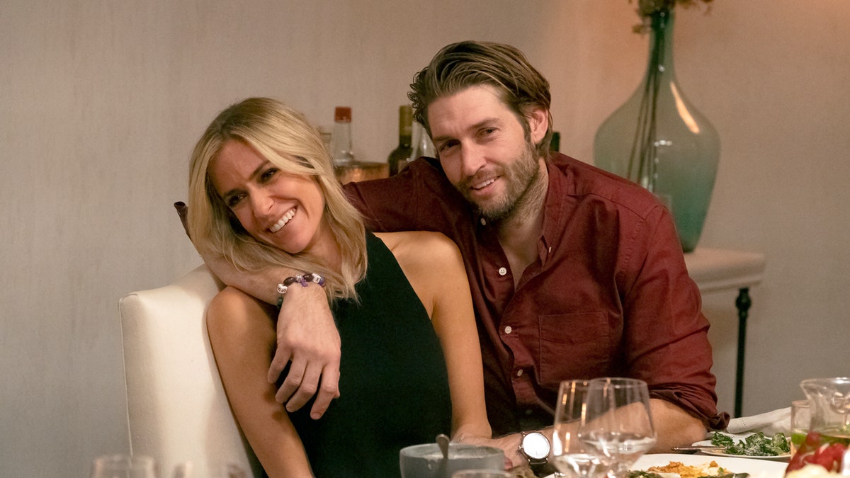 Kristin Cavallari and Jay Cutler sit at a table together