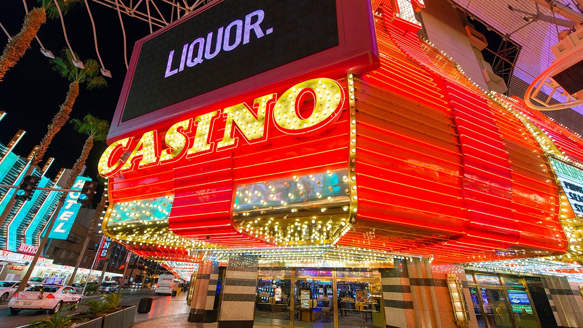 Casino and liquor signs lit up on Las Vegas Strip