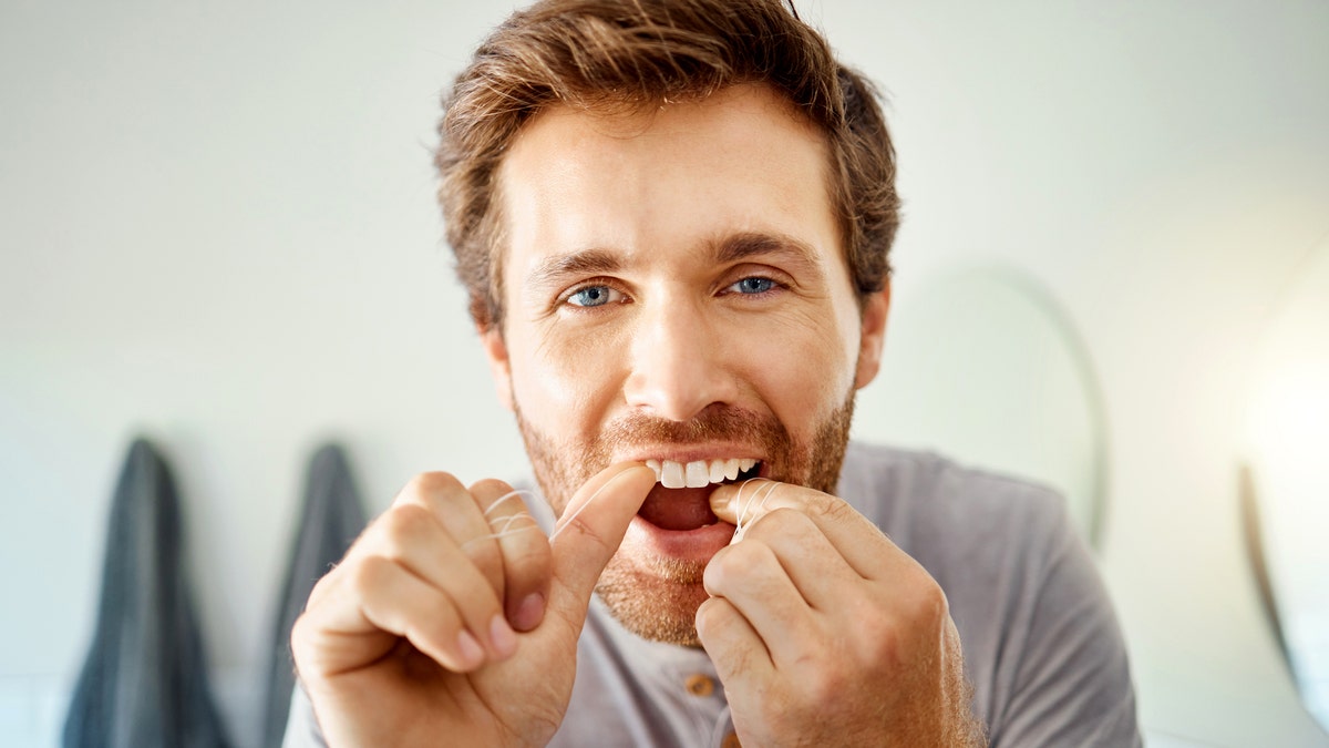 Man flossing