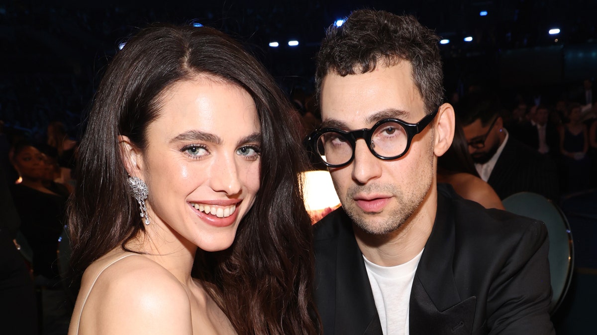 Margaret Qualley and Jack Antonoff pose for a photo