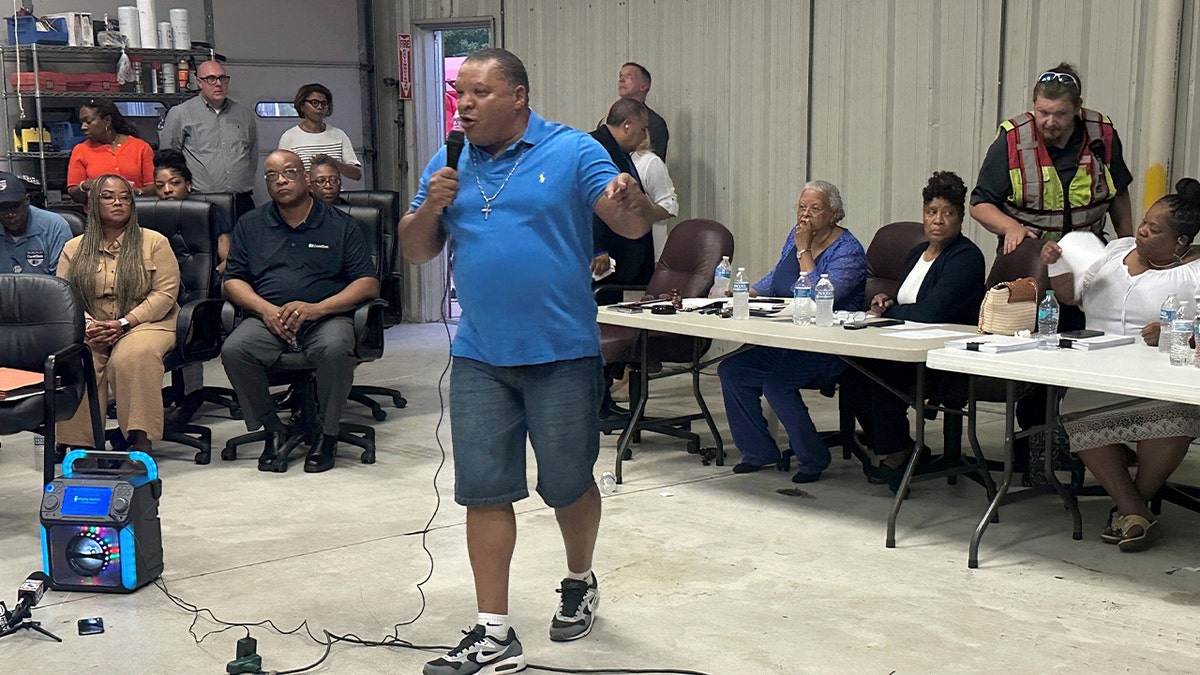 Resident speaks during town meeting on turning former prison into ICE center