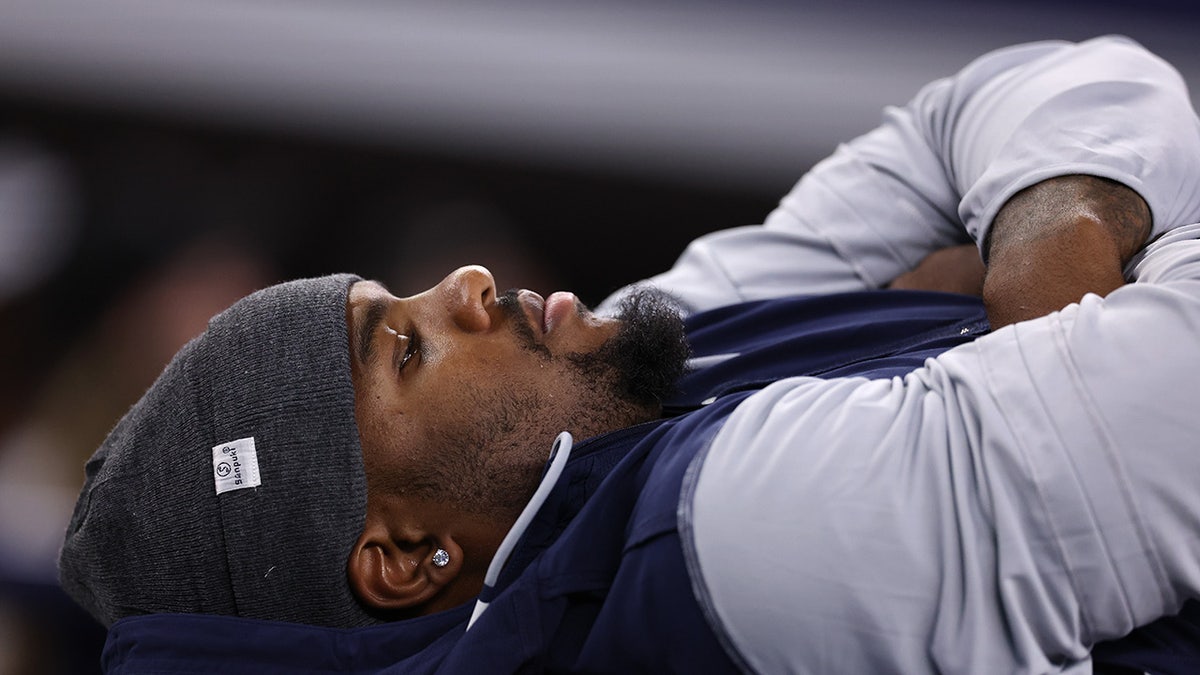 Micah Parsons lays on a training table 