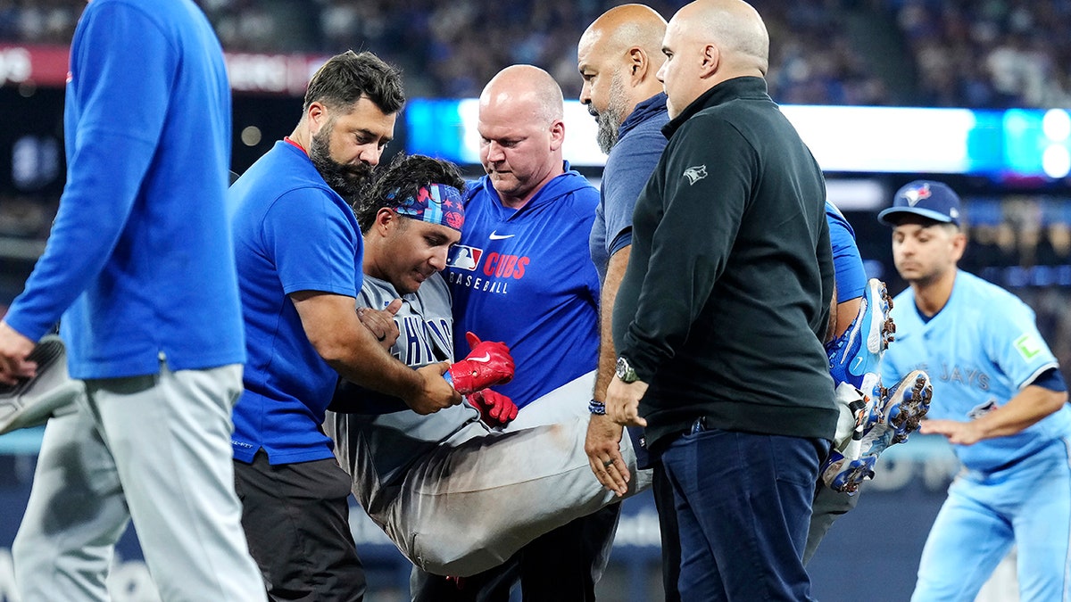 Miguel Amaya carried of the field