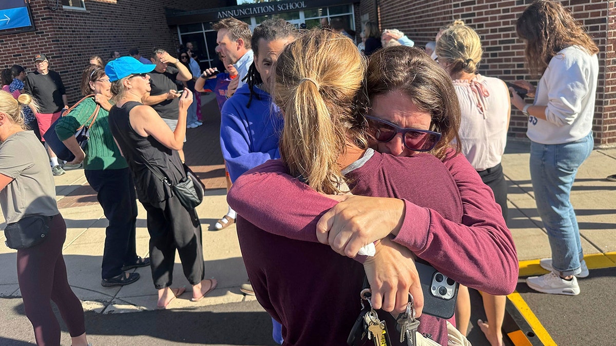 School shooting in Minneapolis, people hugging