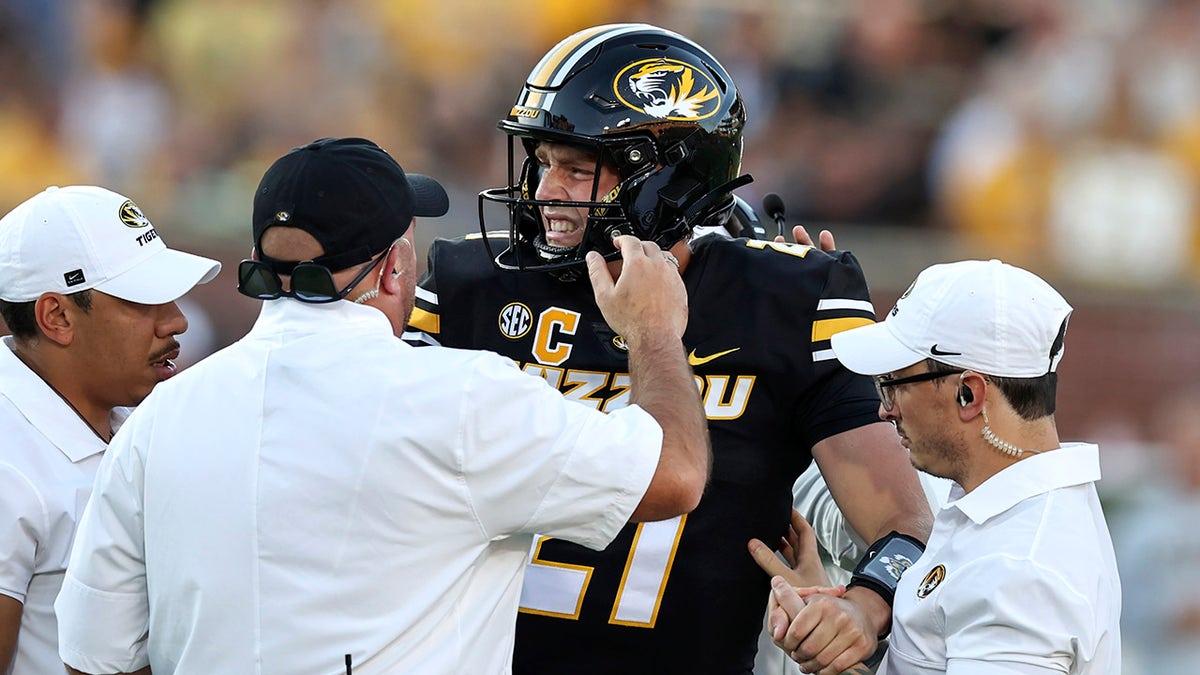 Sam Horn winces in pain
