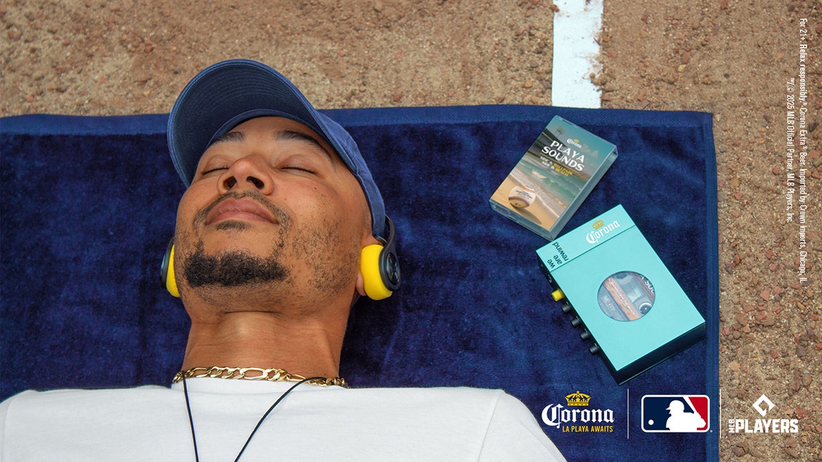 Mookie Betts lying down with headphones on