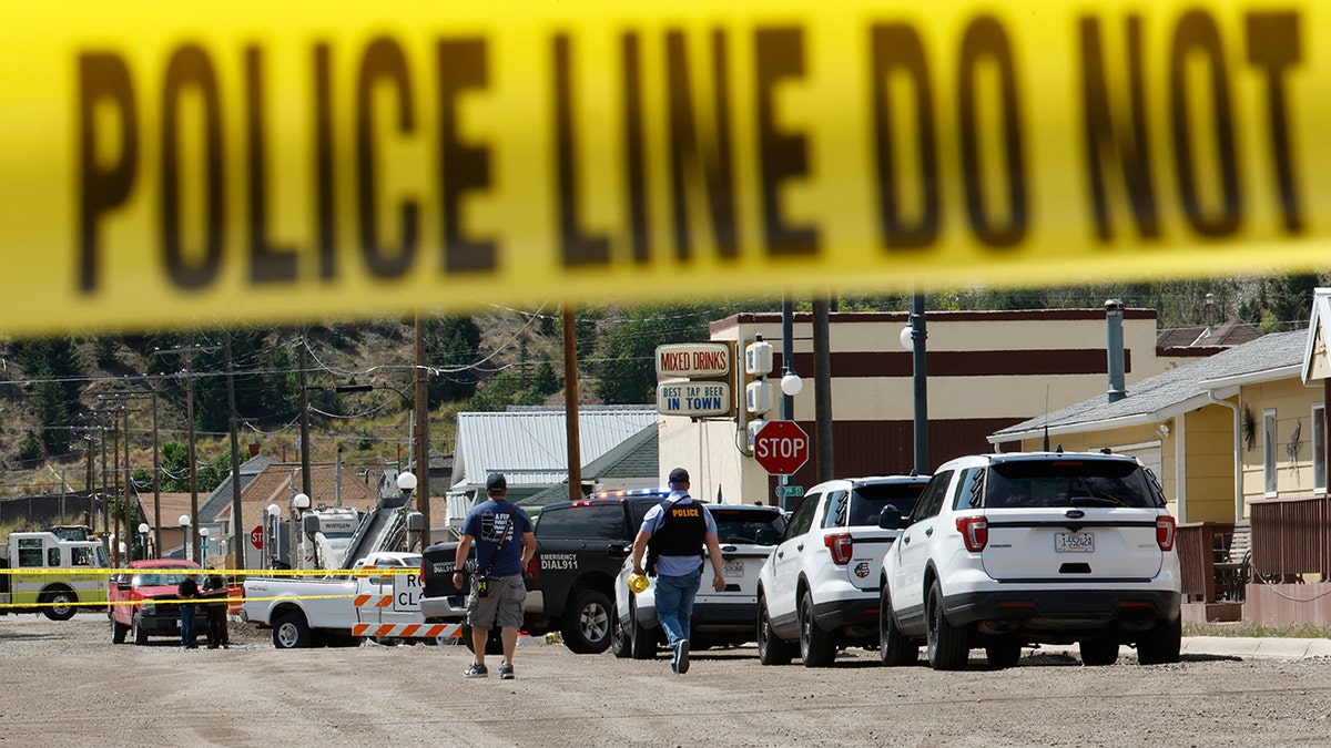 Police and other emergency personnel are seen after a reported shooting in Anaconda, Mont., Friday, Aug. 1, 2025.