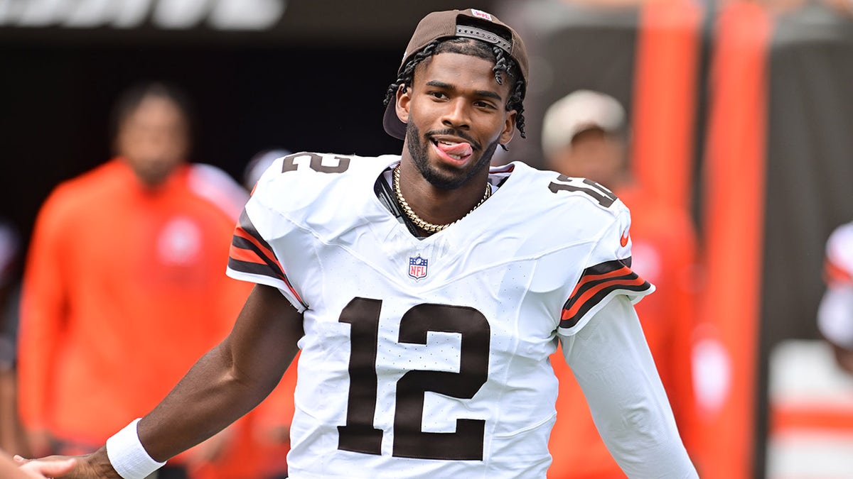 Shedeur Sanders runs out onto the field