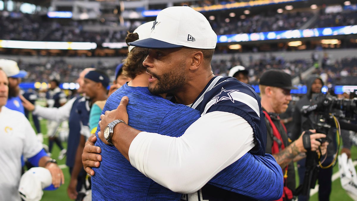 Dak Prescott hugs Matthew Stafford