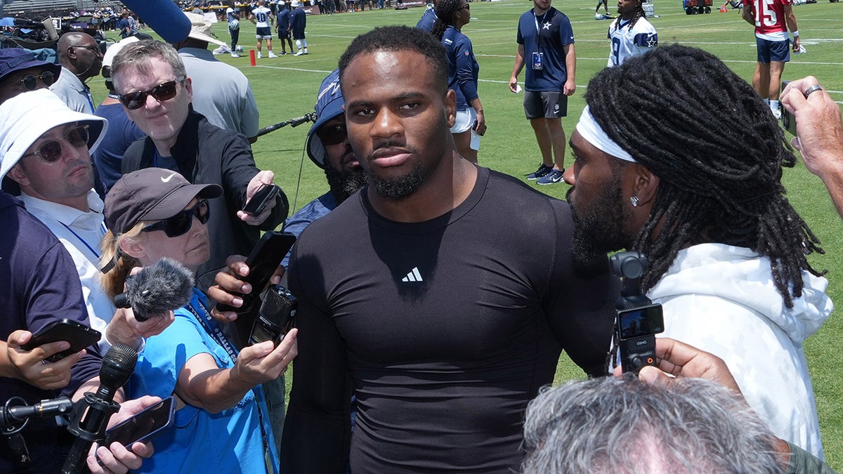 Micah Parsons talks to reporters