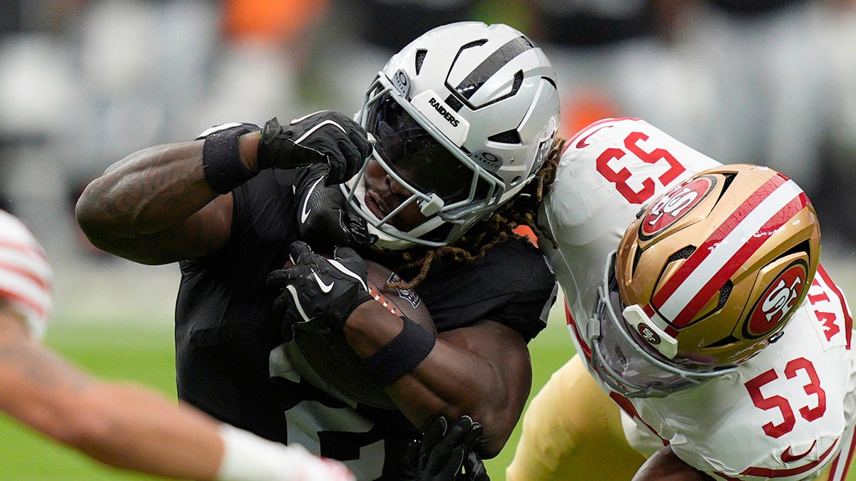 Ashton Jeanty tackled