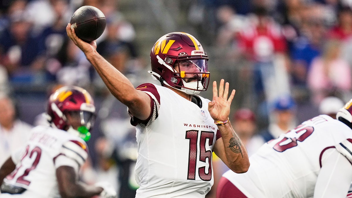 Sam Hartman throws a pass