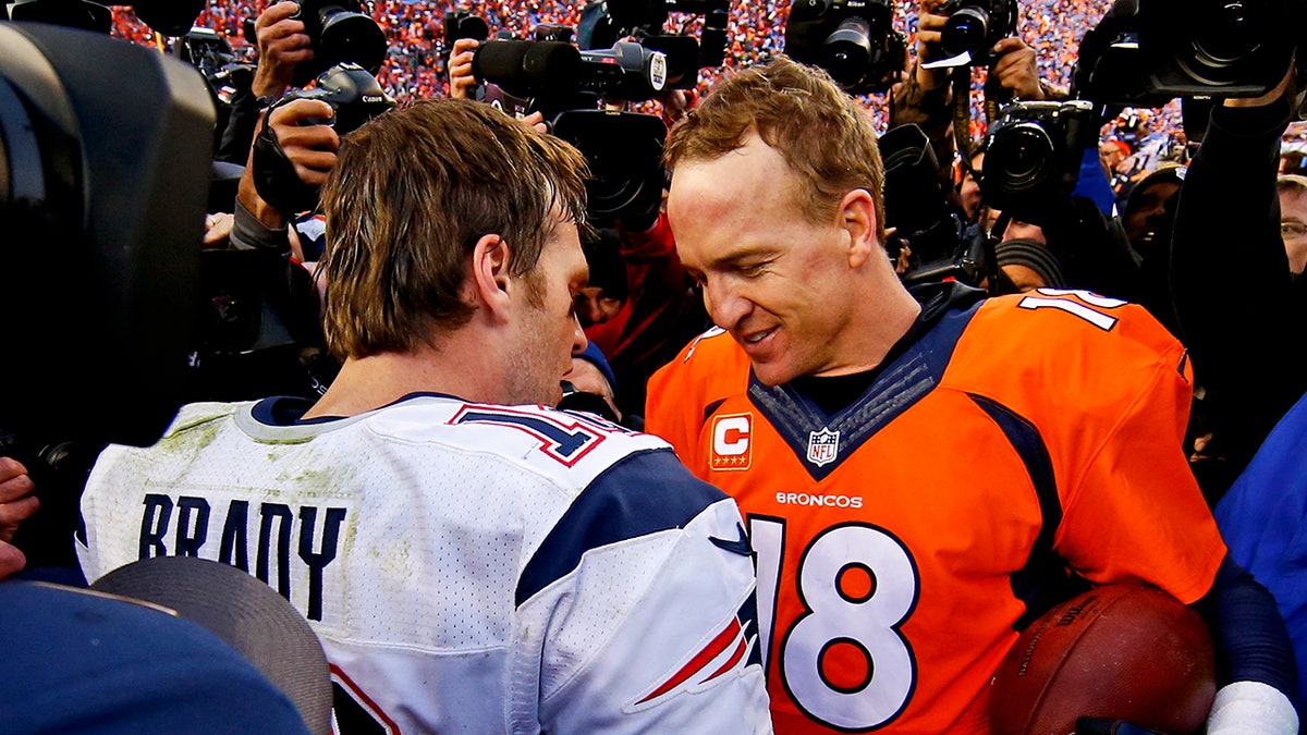Tom Brady chats with Peyton Manning