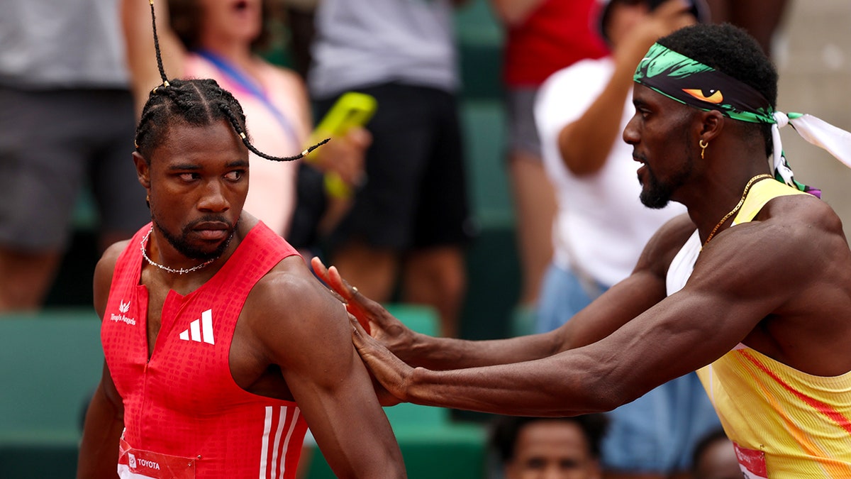 Kenny Bednarek pushes Noah Lyles after race