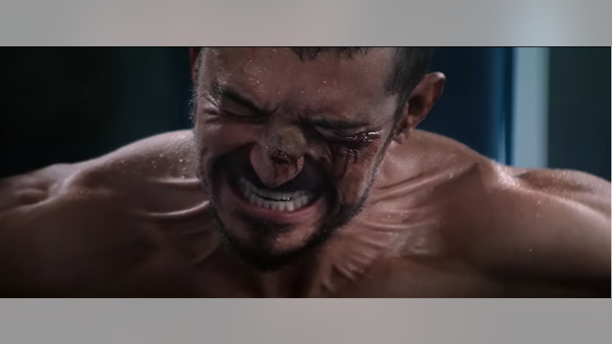 Orlando Bloom grimaces in a scene from "The Cut."