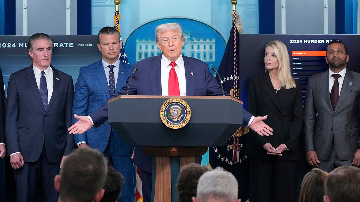 President Donald Trump with Attorney General Pam Bondi, FBI Director Kash Patel and other administration officials. 