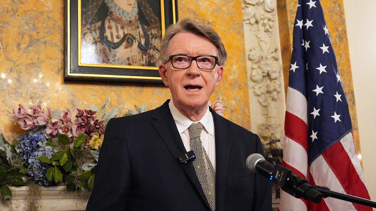 Peter Mandelson speaks at podium