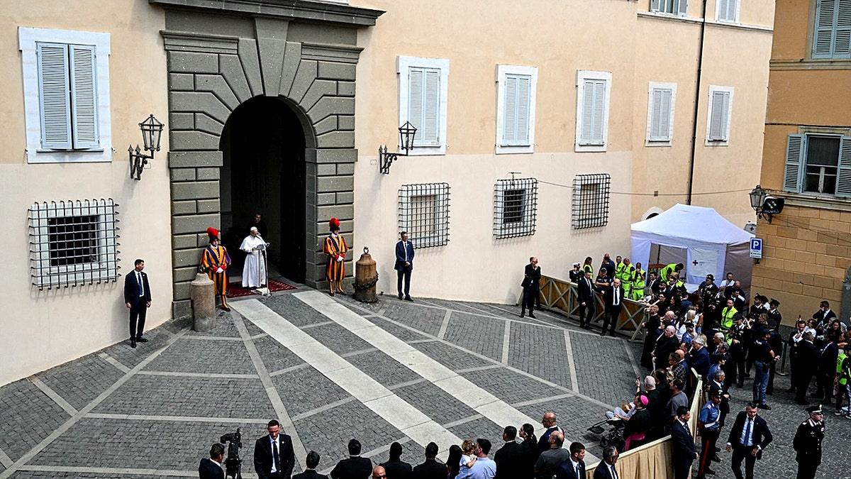 Pope Leo XIV speaks outside the Apostolic Palace