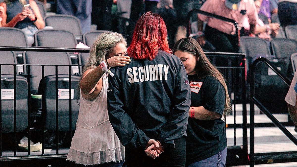 Moda Center staff praying with church volunteers