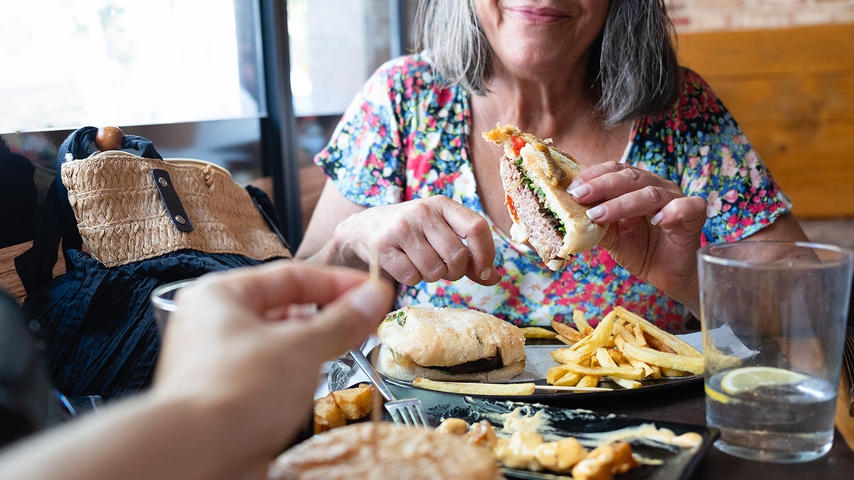 Diners eating burgers