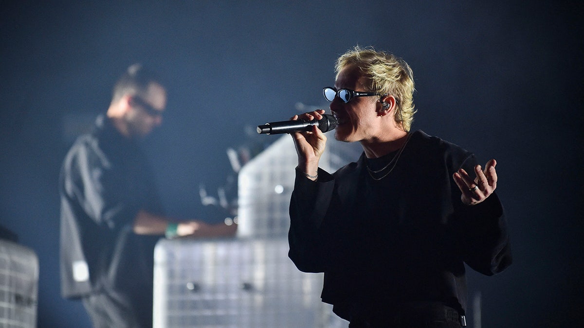 Rufus Du Sol's Tyrone Lindqvist wears black on stage