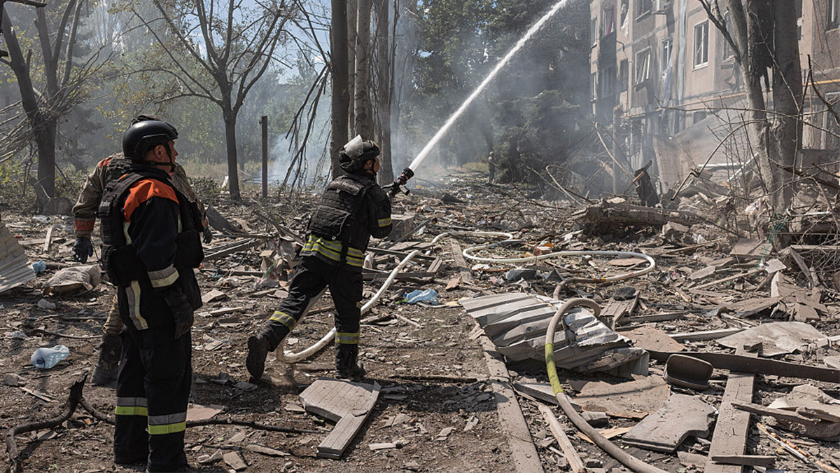 Ukrainian firefighters are looking for survivors after a Russian air strike on a residential building