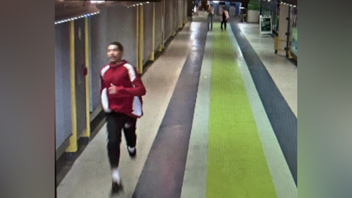 Surveillance image of John Nino running at Sea-Tac Airport