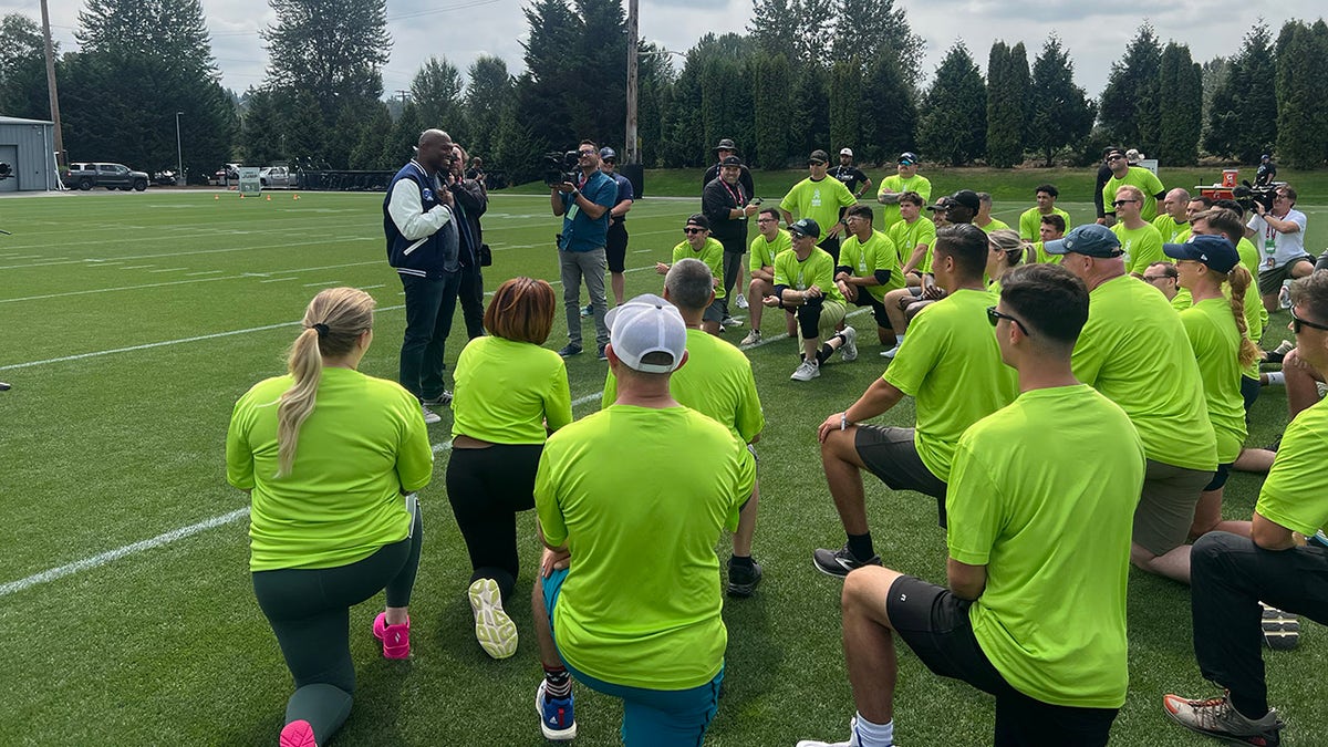 Shaun Alexander speaks to military members