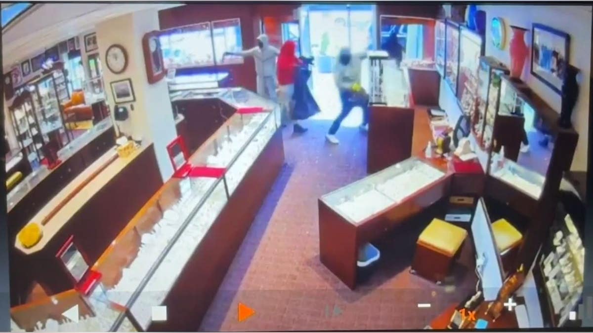 Thieves breaking into store on surveillance
