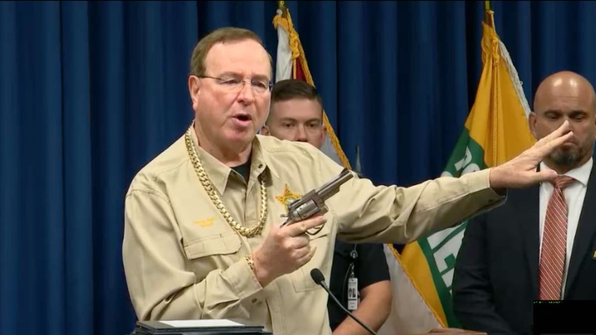 Sheriff Grady Judd holds a revolver seized in a Bartow drug trafficking investigation.