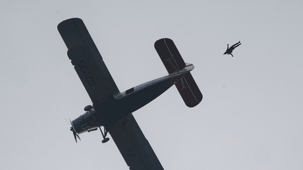 skydiver jumps out of small plane