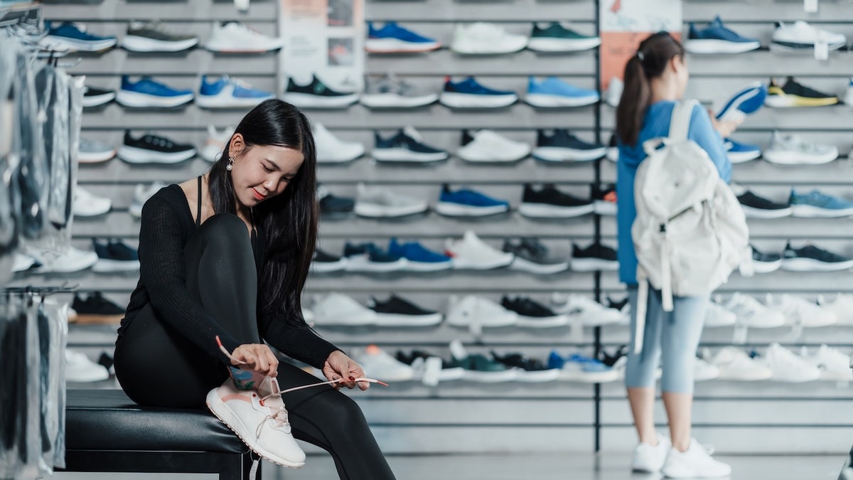 woman shopping for sneakers