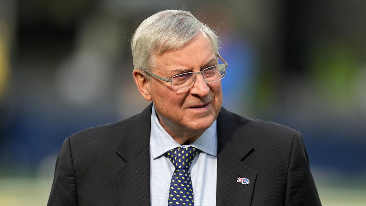 Terry Pegula on Rams field before game