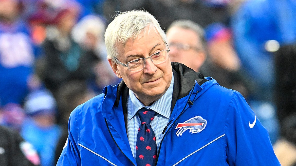 Bills owner Terry Pegula walks on field