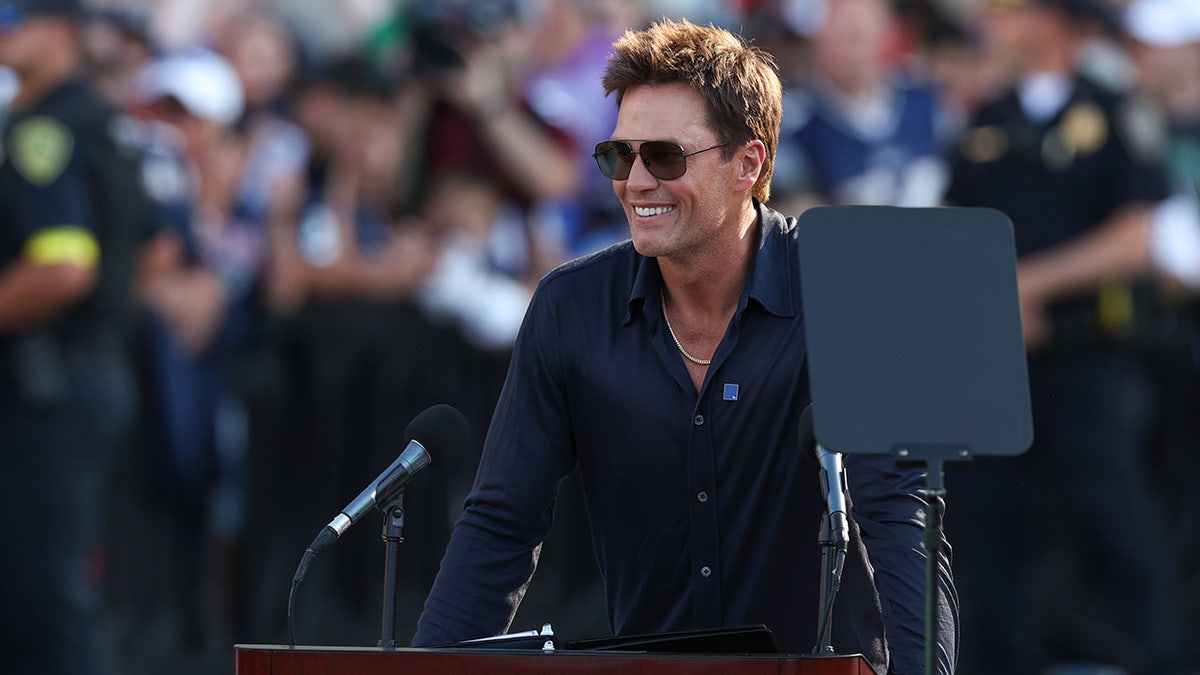 Tom Brady speaks during a statue unveiling