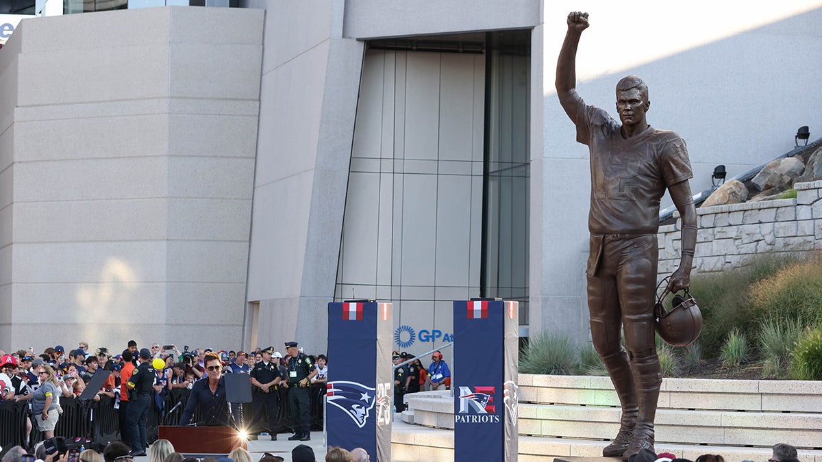 Tom Brady speaks during a statue unveiling