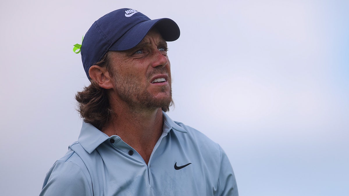 Tommy Fleetwood admires shot on golf course