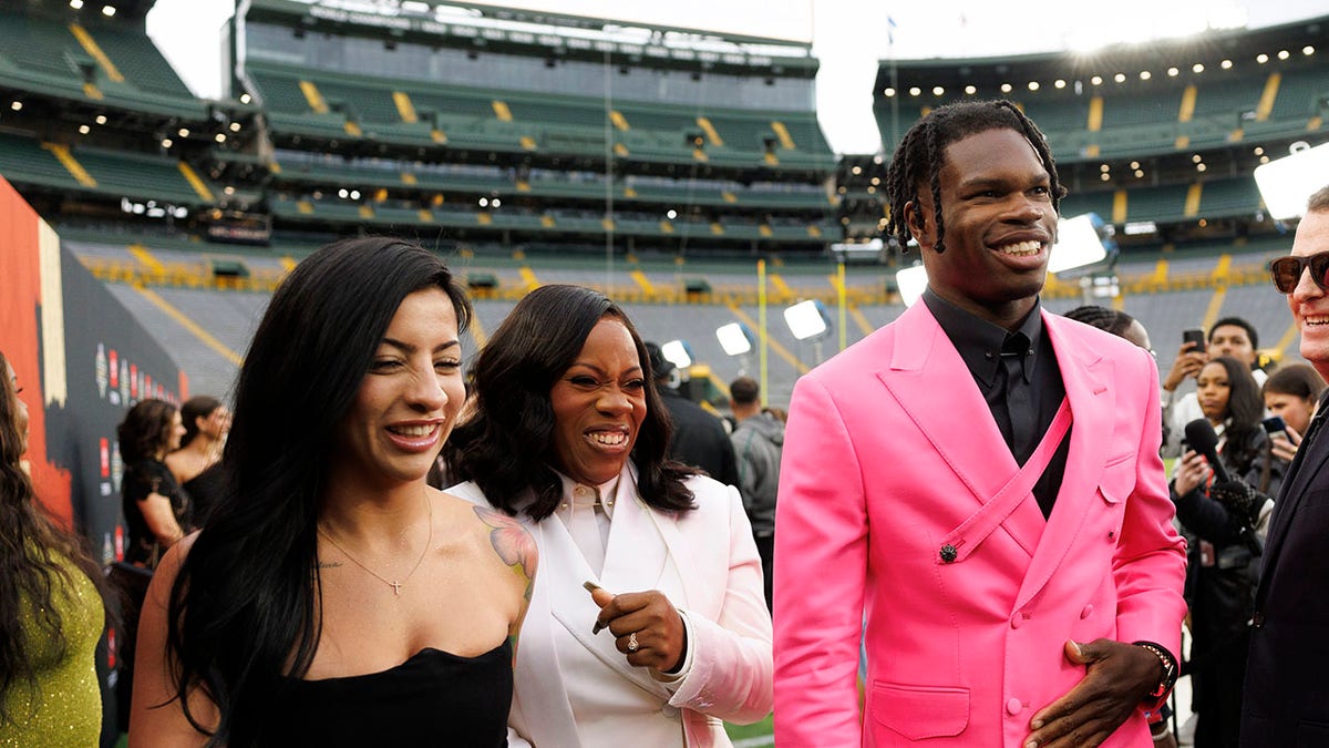 Travis Hunter and wife