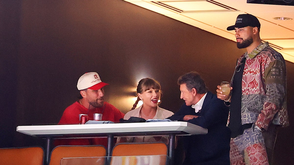 Travis Kelce, Taylor Swift and Ross Travis at the Stanley Cup Final