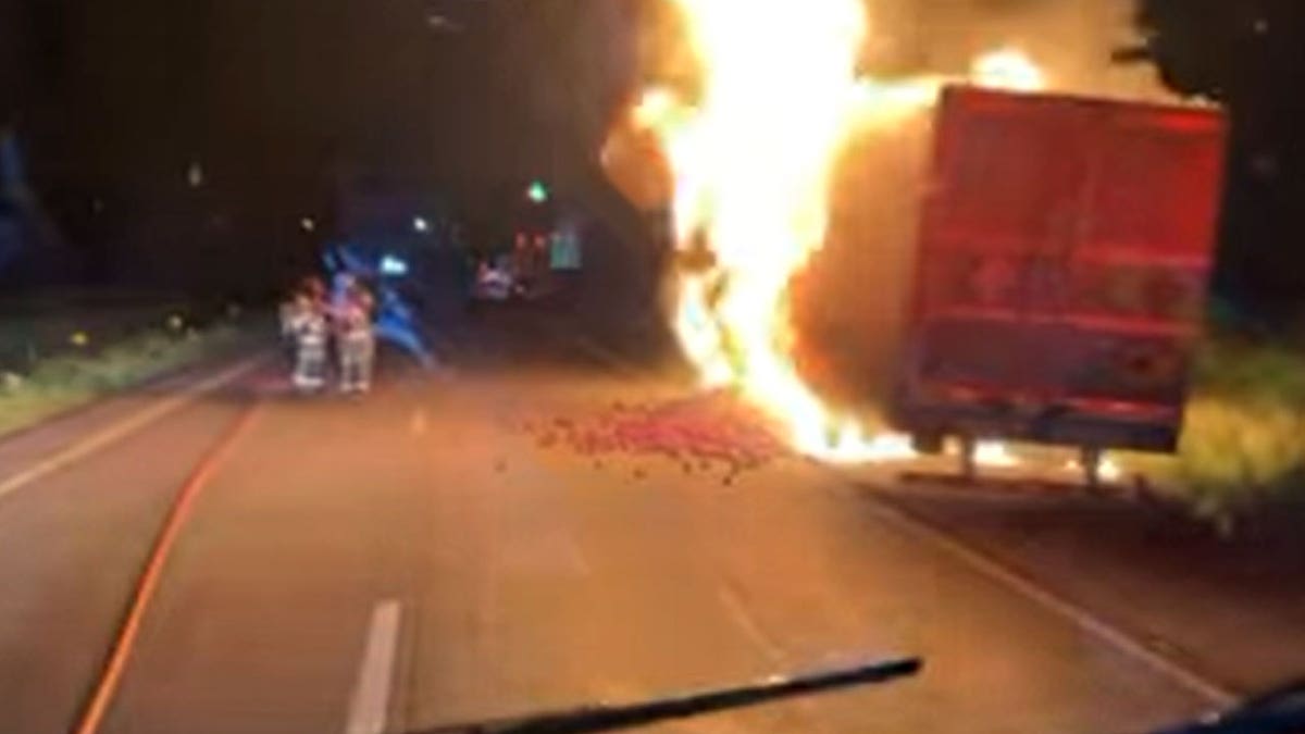 Tractor-trailer on fire with onions in cargo