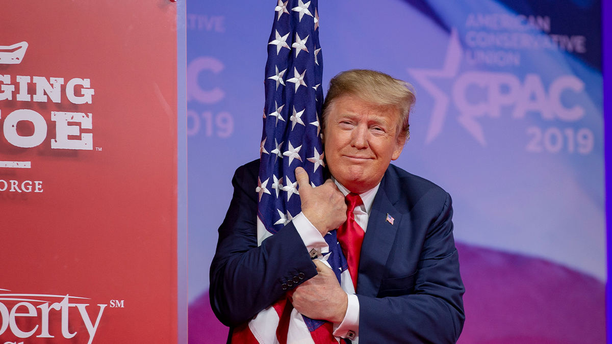 President Trump kisses the American flag