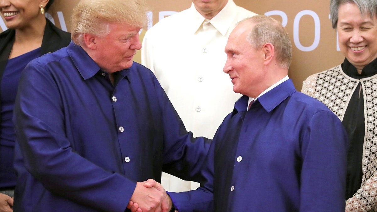 Trump and Putin interact at APEC summit 2017