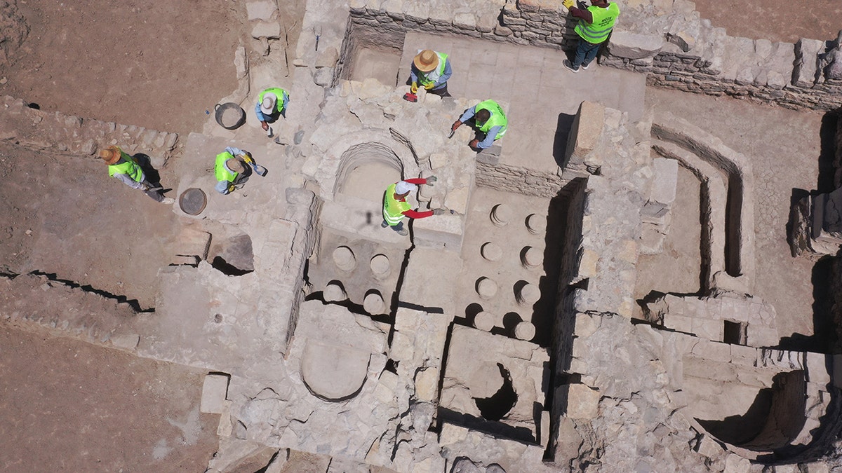 Aerial shot of archaeologists excavating