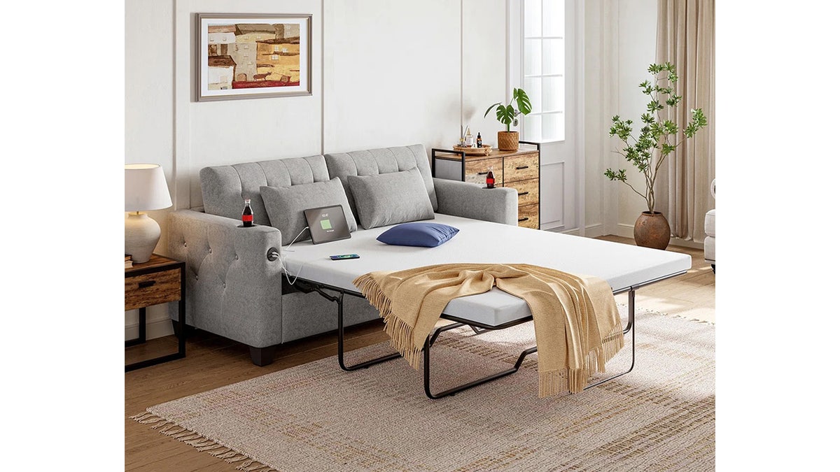 This sleeper sofa comes with LED lights, USBs and cupholders. 
